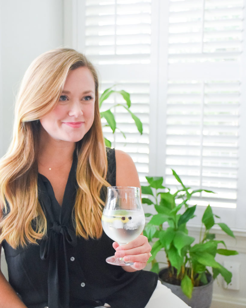 Blond woman holding glass