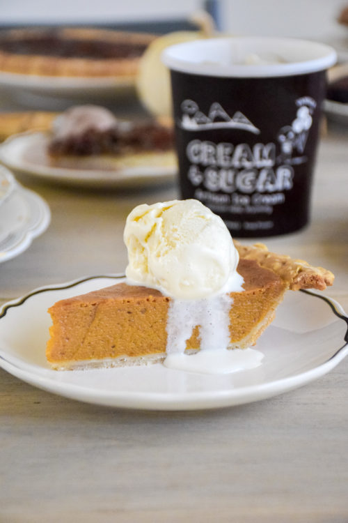 Pie and Ice Cream on a light colored wood table