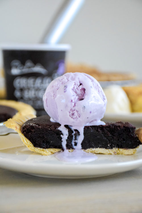 Pie and Ice Cream on a light colored wood table