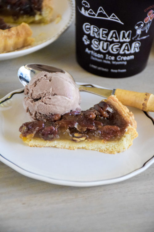 Pie and Ice Cream on a light colored wood table