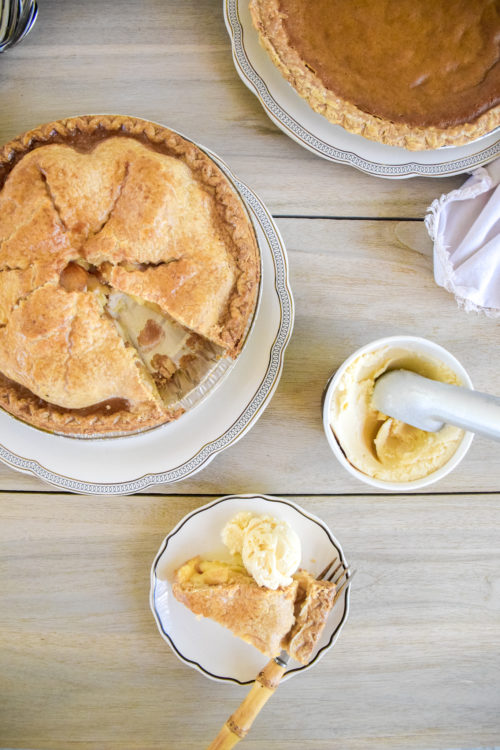 Pie and Ice Cream on a light colored wood table