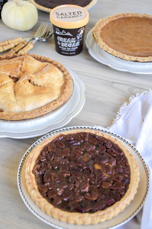 Pie and Ice Cream on a light colored wood table